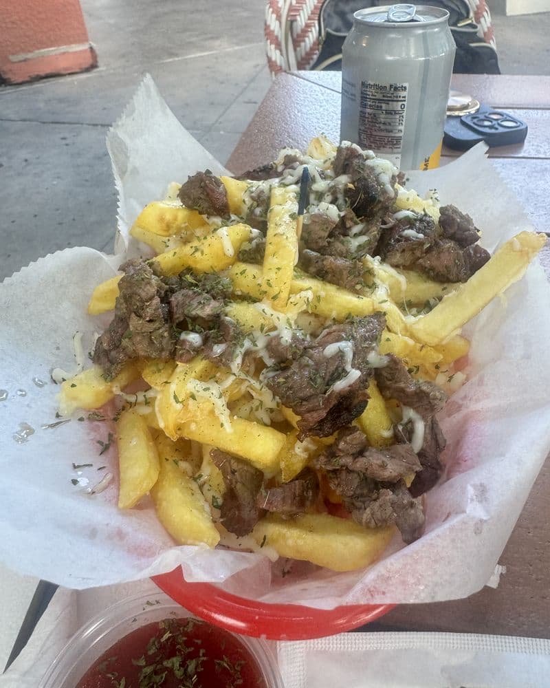 Loaded fries piled with chopped steak